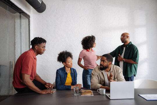 Diverse Team in Casual Business Meeting Discussing Strategy