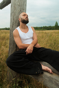A Man Is Quietly Relaxing Alone In Nature