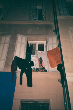 Laundry drying on a clothesline from a Paris window