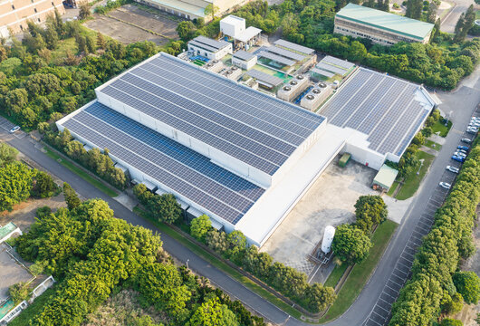 Aerial View of Modern Factory with Solar Panels