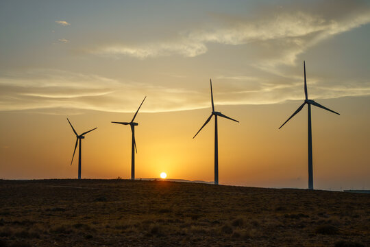 Four wind Turbines at Sunset