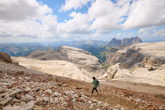 Woman goes on a hike in the Dolomites