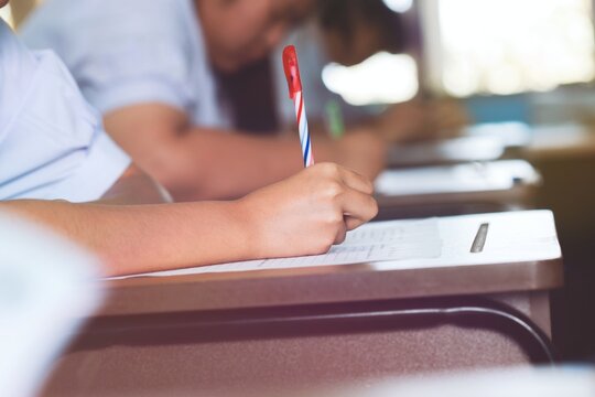 The students were doing the exams inside the classroom with stress.Assessment examination of high school students