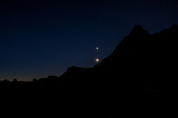 Crescent Moon and Venus above volcanic silhouette before dawn in Tenerife © Peter