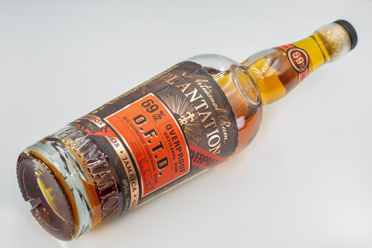 Plantation overproof dark rum bottle closeup on white.