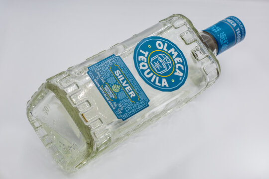 Olmeca Tequila Silver Mexican bottle closeup on white.