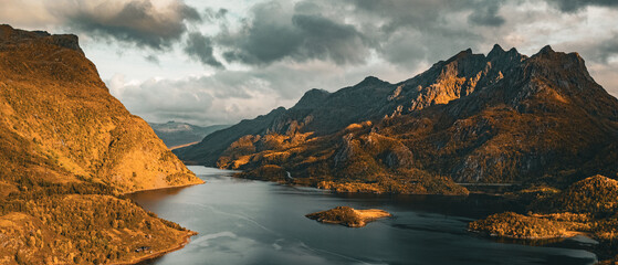 Panoramic aerial view of a scenic fjord surrounded by majestic autumn mountains in northern Norway © Quality by Simon