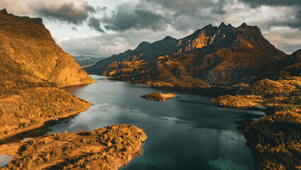 Panoramic aerial view of a scenic fjord surrounded by majestic autumn mountains in northern Norway © Quality by Simon