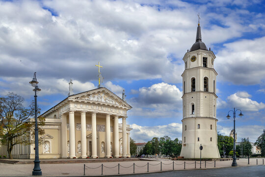 View of Vilnius Cathedral and the bell tower in Vilnius, Lithuania. Classical stone architecture under partly cloudy sky