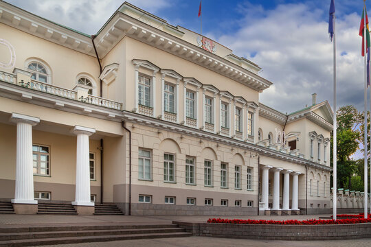Close-up view of the Presidential Palace facade in Vilnius, Lithuania. Empire style stone architecture and cloudy sky