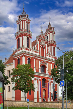 Front view of the Church of St. Jacob and Philip facade in Vilnius, Lithuania. Brick Baroque architecture and cloudy sky