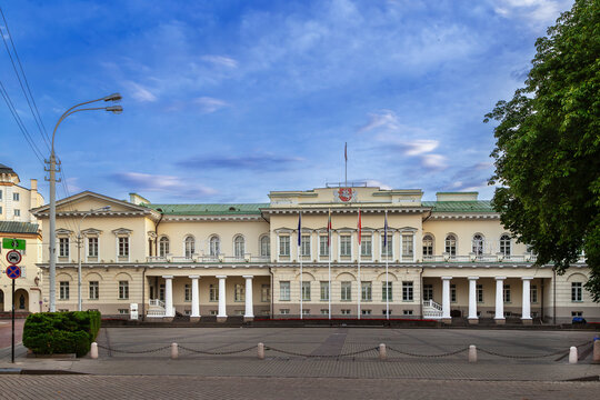 Distant courtyard view of the Presidential Palace in Vilnius, Lithuania. Empire style stone architecture and cloudy sky