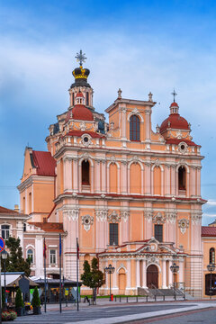 Front view of the facade of Church of St. Casimir in Vilnius, Lithuania. Baroque stone architecture under cloudy sky