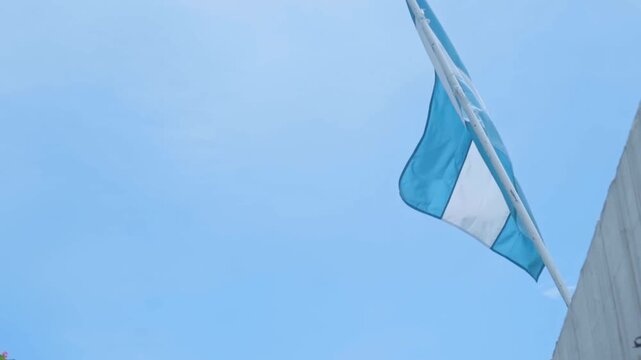 National flag of honduras waving on a pole
