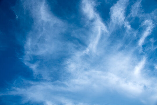 Blue sky with wispy white cirrus clouds