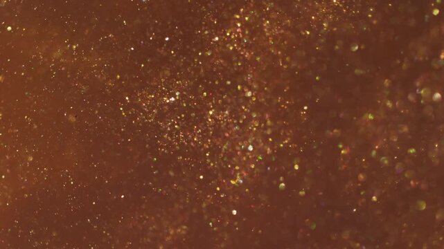 Bokeh leak twirl. Flare glimmer. Red orange yellow mixing light flow. Shimmering color particles spill abstract art reflection background.