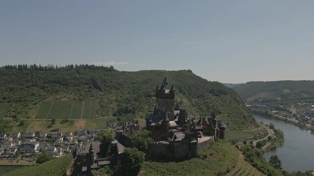 Reichsburg Cochem Castle Aerial Rise Over Vineyards