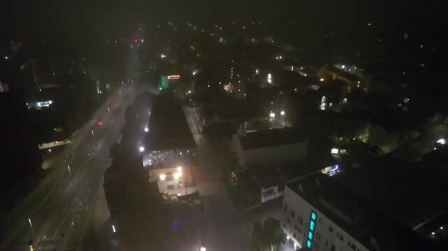 Aerial Night Footage of Illuminated Central Plymouth City Drone Tour over Main Street Buildings of England United Kingdom. June 28th, 2025
