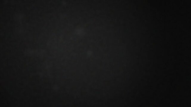 Dark abstract textured grunge background surface with subtle variations and moody shadows