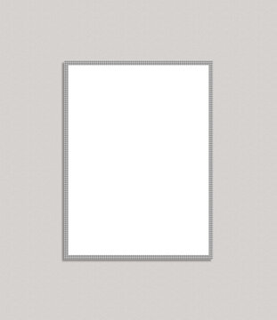 Empty vertical picture frame with decorative silver border on a textured light gray background