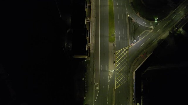 Aerial Night Footage of Illuminated Central Plymouth City Drone Tour over Main Street Buildings of England United Kingdom. June 28th, 2025