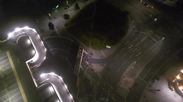 Aerial Night Footage of Illuminated Central Plymouth City Drone Tour over Main Street Buildings of England United Kingdom. June 28th, 2025