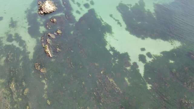 High Angle Footage of Beach and Ocean at Looe Town of England During Hot Sunny Day. Looe is a coastal town and civil parish in southeast Cornwall, England, United Kingdom.