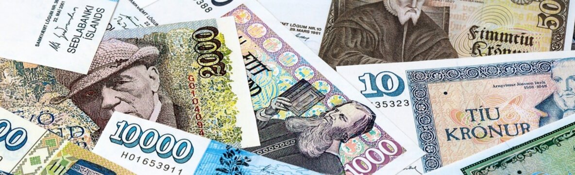 Icelandic krona money bills in pile on table. Iceland ISK currency cash close up