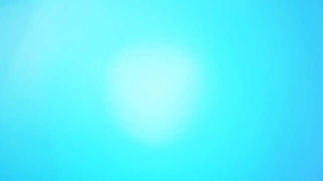 Bright vibrant cyan and turquoise abstract background texture with smooth soft gradient lighting and glowing central illumination