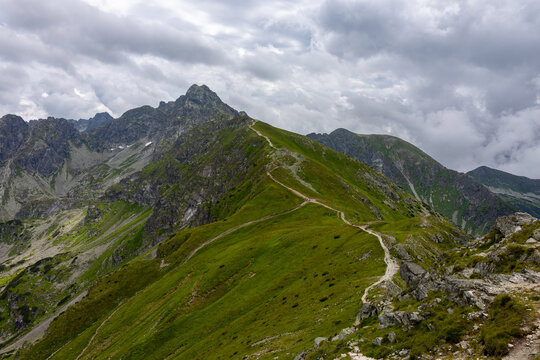 Winding hiking trail along mountain ridge at Kasprowy Wierch in Tatras