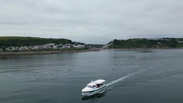 High Angle Footage of Beach and Ocean at Looe Town of England During Hot Sunny Day. Looe is a coastal town and civil parish in southeast Cornwall, England, United Kingdom.