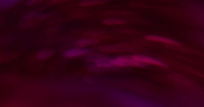 Defocused glow. Light beam. Blur purple pink neon color optical round texture reflection glint kaleidoscope on visual bokeh background.
