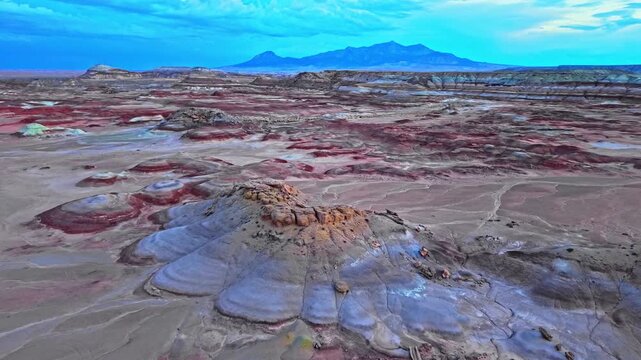 Vibrant striped clay hills glow under twilight skies near Capitol Reef National Park in south-central Utah during blue hour