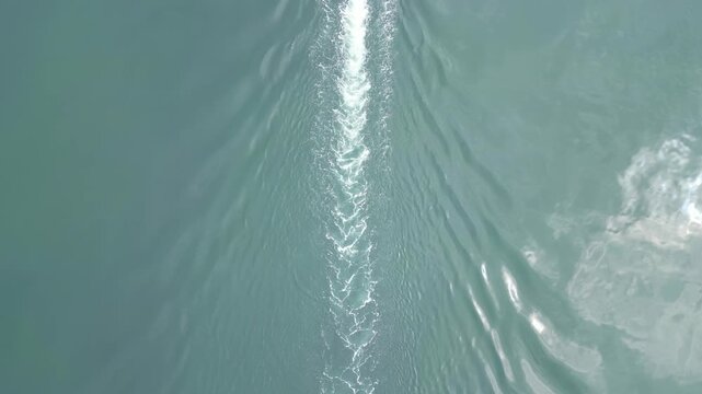 High Angle Footage of Beach and Ocean at Looe Town of England During Hot Sunny Day. Looe is a coastal town and civil parish in southeast Cornwall, England, United Kingdom.