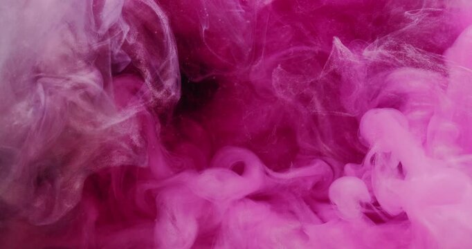 Ink water. Vapor pink cloud. Defocused color fog splash vibrant glitter explosion smoke floating texture on abstract art background.