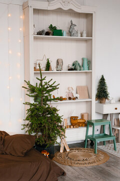 Festive Nursery Interior with Christmas Tree and Toys