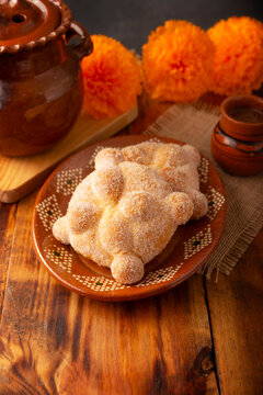Pan de Muerto. Traditional Mexican sweet bread that is consumed in the season of the day of the dead. It is a main element in the altars and offerings in the Dia de Muertos celebration.