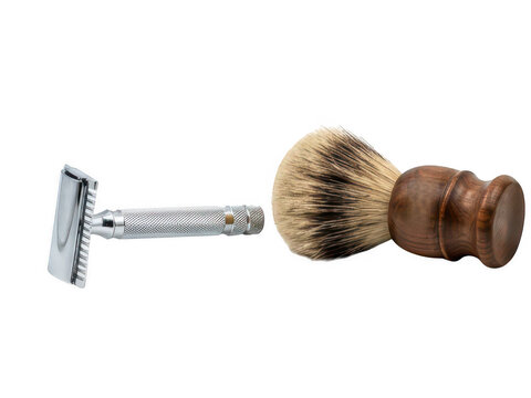 Classic safety razor and wooden shaving brush isolated on transparent background. Ideal for traditional men grooming product design.