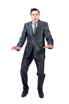 Full body of shocked male in elegant suit looking at camera with astonished face expression