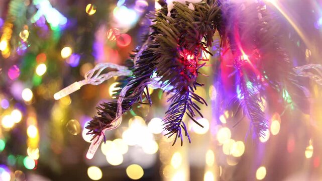 Christmas lights on pine branches close-up, cinematic festive bokeh,  holiday decoration, warm magical atmosphere.
