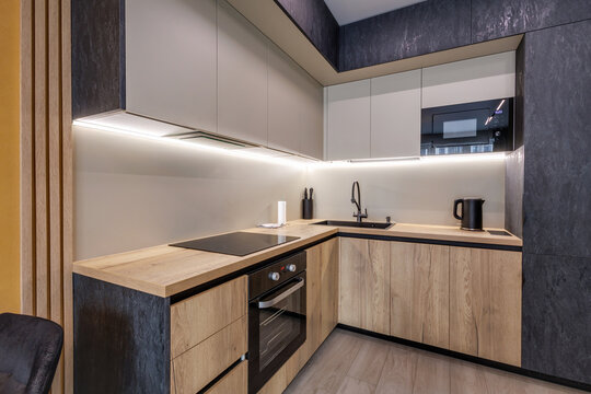 Interior of the modern luxure kitchen work area  in studio apartments in minimalistic style