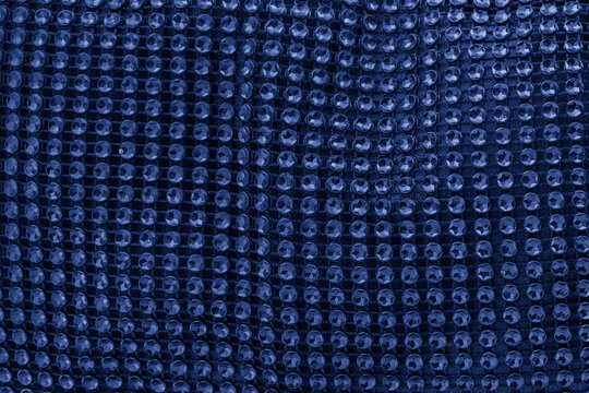 Blue rhinestones creating a shimmering glittering texture background