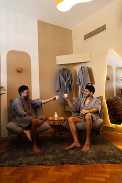 Two Men Relaxing in Bathrobes at Luxury Wellness Spa