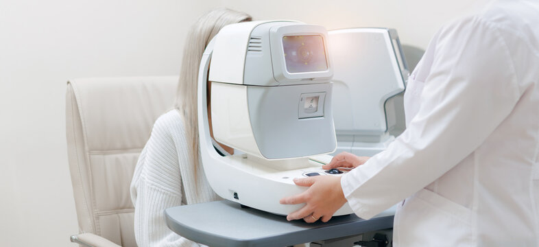 Patient receiving vision screening with autorefractor in clinic Ophthalmologist, banner