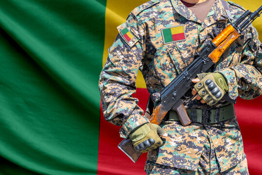 Benin flag with soldier holding assault rifle