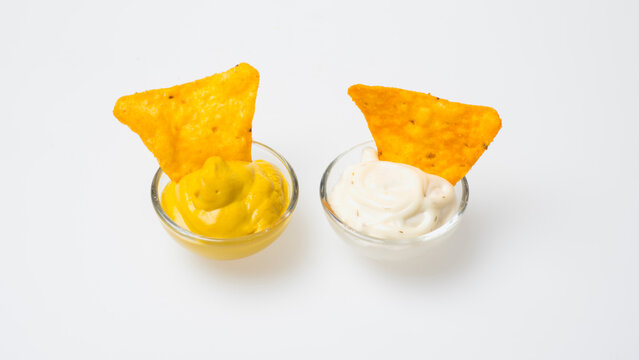 Tortilla chips with salsa and sour cream dips