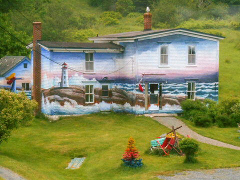 PEGGY&rsquo;S COVE, NS &mdash; JUNE 18, 2018: A maritime mural by Ivan Fraser covers the exterior of the Peggy of the Cove Museum near the coastal village.