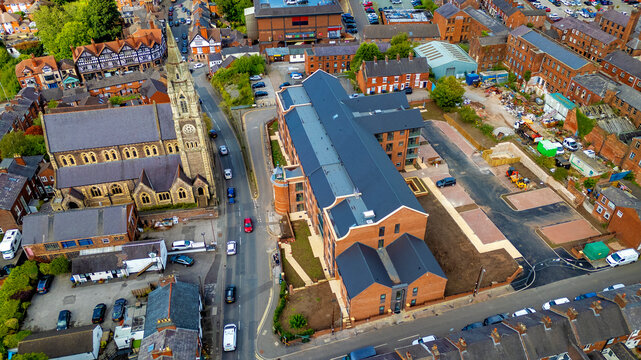 Drone perspective of new residential construction near parish church