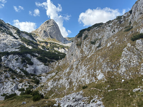 Dramatic limestone peak in a mountain valley