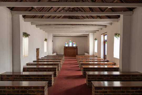 Interior of church showing pulpit and benches